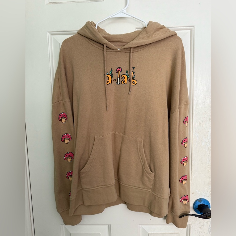 Zumiez Tan Hoodie with Pink Mushroom Accents